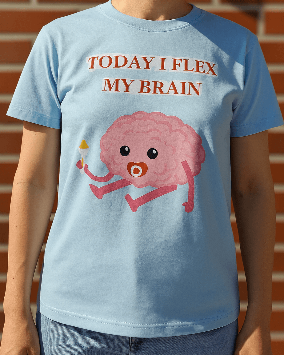 Light blue t-shirt with pink brain graphic and quote "Today I flex my brain" – creative and clever fashion